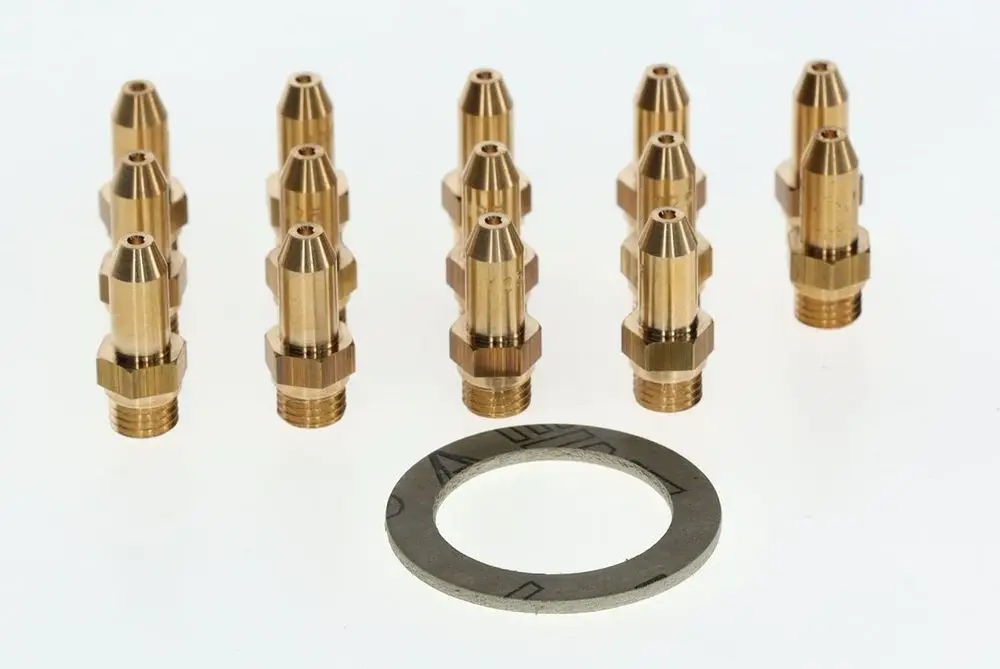 Mehrere gasbetriebene Düsen aus Messing in unterschiedlicher Höhe, angeordnet in zwei Reihen, mit einem flachen Dichtungsring in der Mitte. Zubehör für Bosch Produkte.